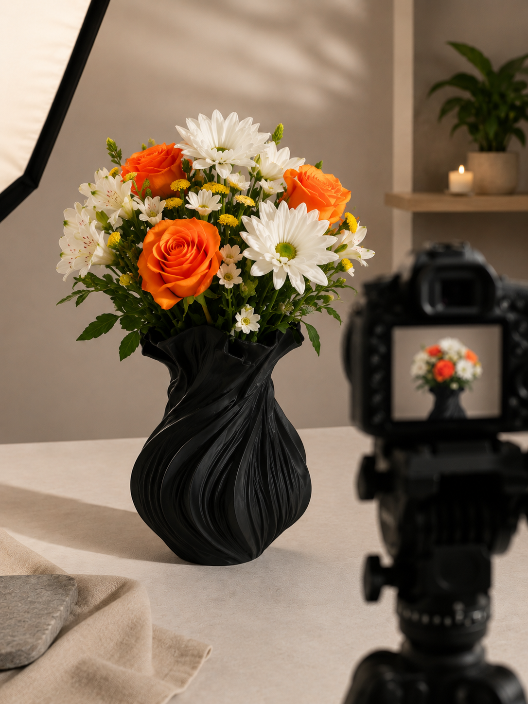 Black Wave Vase 3D printed decor piece styled on a studio table with flowers