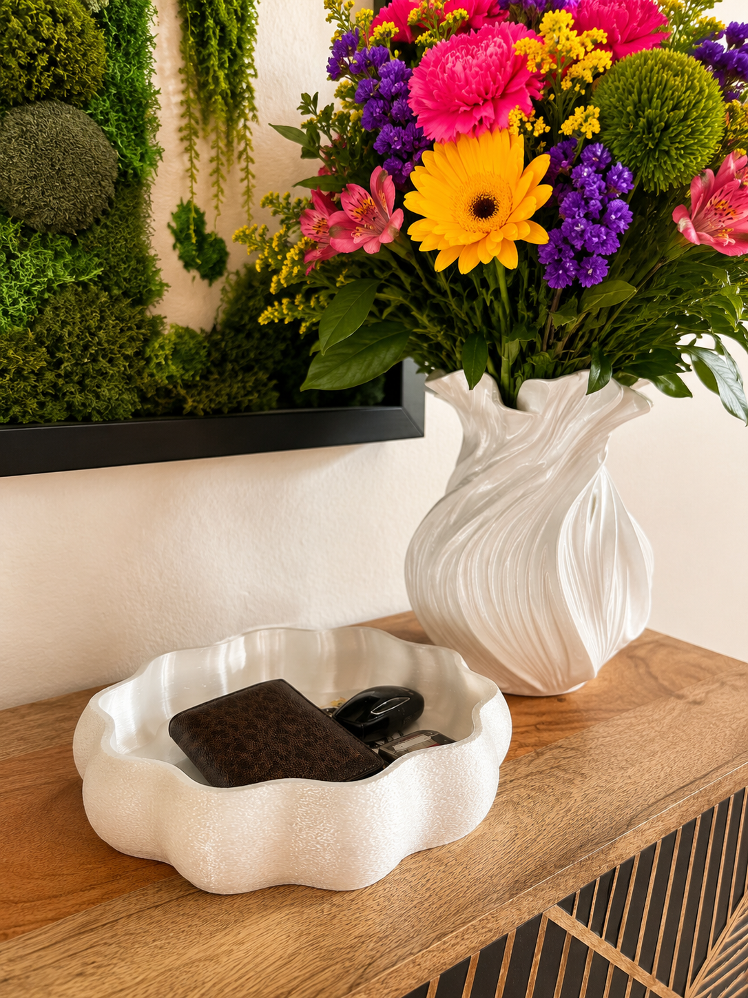 Close-up of the white fuzzy-texture Ripple Tray organizing keys and wallet on a wooden console table