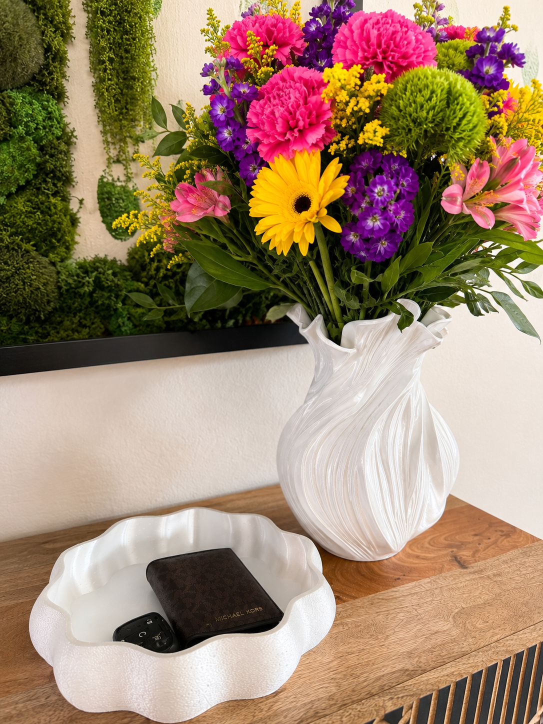 White Ripple Tray 3D printed catchall on an entryway console holding car keys and a wallet beside a vase of flowers