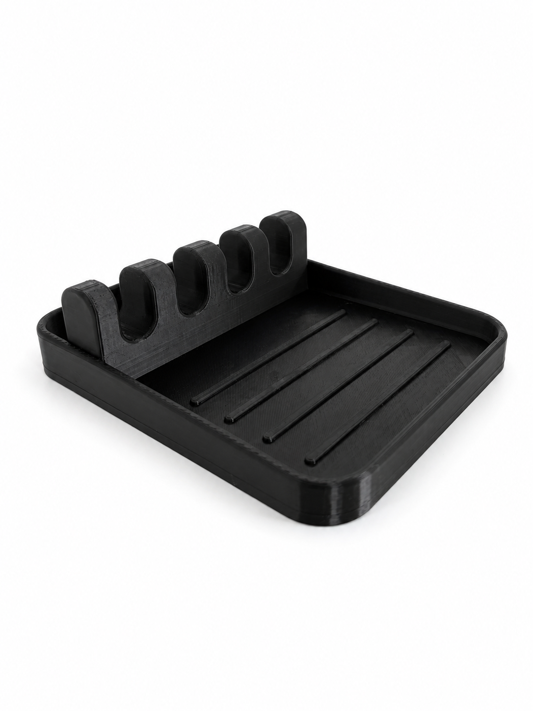 Angled view of the black PETG Stir & Rest spoon holder showing the five utensil slots and drip tray